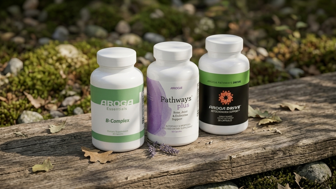 Bench with three bottles of Aroga products: - Essentials B Complex - Pathways Plus Bone and Endocrine - Aroga Pathways Drive